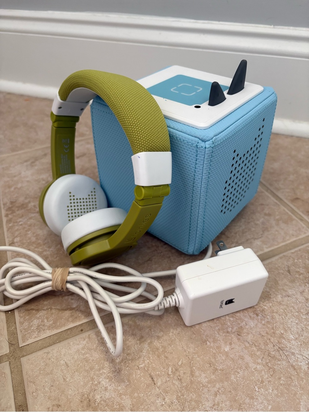 Blue Tonies box with green Tonies headphones